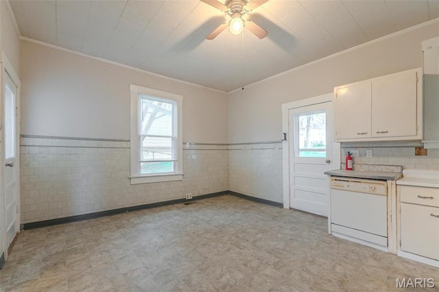338 Horn Ave, Saint Louis, MO 63125 - kitchen featuring white dishwasher, light flooring, crown molding, wainscoting, and white cabinetry