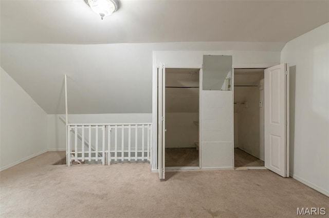 338 Horn Ave, Saint Louis, MO 63125 - unfurnished bedroom with carpet, vaulted ceiling, and baseboards