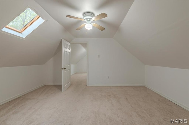 338 Horn Ave, Saint Louis, MO 63125 - bonus room featuring a skylight, carpet, vaulted ceiling, baseboards, and ceiling fan