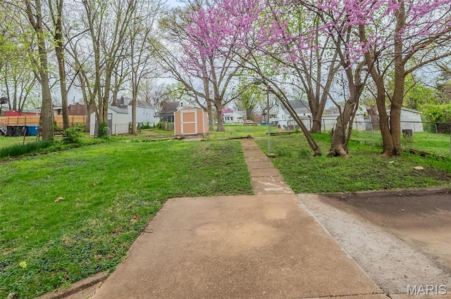 338 Horn Ave, Saint Louis, MO 63125 - view of yard featuring a shed, an outdoor structure, and a residential view