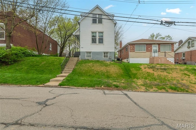 338 Horn Ave, Saint Louis, MO 63125 - view of front of home featuring stairs and a front yard