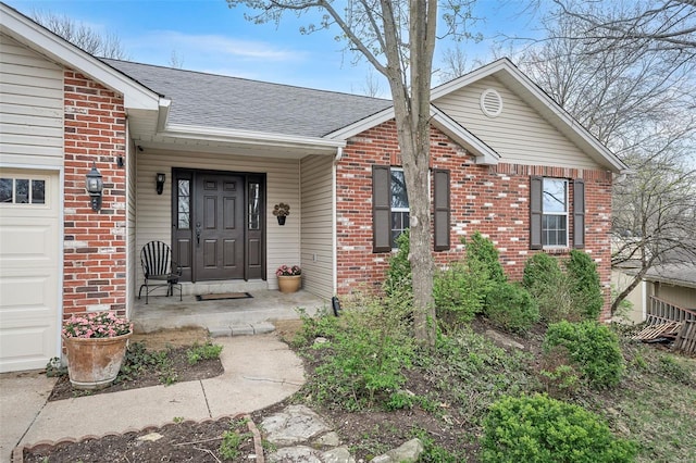 413 Oak Pl, Lake St Louis, MO 63367 - entrance to property with brick siding, a shingled roof, and a garage