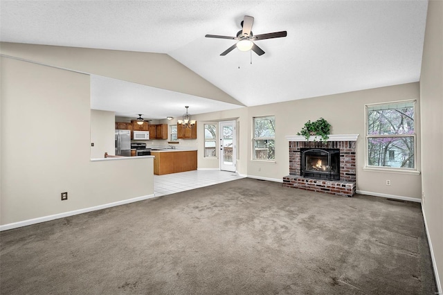 413 Oak Pl, Lake St Louis, MO 63367 - unfurnished living room with a ceiling fan, baseboards, a brick fireplace, carpet flooring, and lofted ceiling