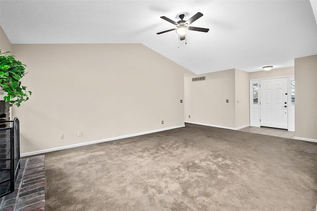 413 Oak Pl, Lake St Louis, MO 63367 - unfurnished living room with ceiling fan, carpet floors, baseboards, and vaulted ceiling