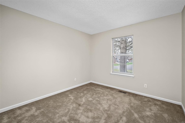 413 Oak Pl, Lake St Louis, MO 63367 - spare room featuring carpet, baseboards, and a textured ceiling