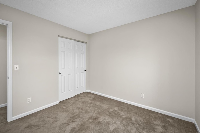 413 Oak Pl, Lake St Louis, MO 63367 - unfurnished bedroom featuring carpet, baseboards, and a closet