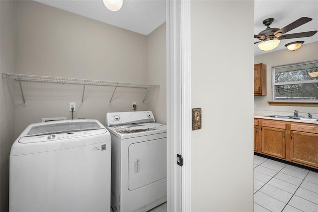 413 Oak Pl, Lake St Louis, MO 63367 - laundry room featuring washer and dryer, light tile patterned flooring, and a ceiling fan