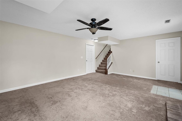 413 Oak Pl, Lake St Louis, MO 63367 - unfurnished living room with a ceiling fan, carpet floors, stairs, and baseboards
