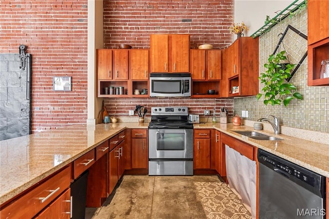 1123 Washington Ave Unit 305, Saint Louis, MO 63101 - kitchen with stainless steel appliances, open shelves, and brown cabinets