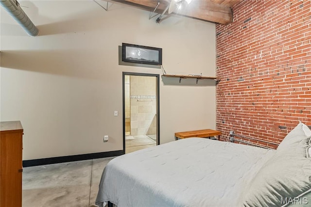 1123 Washington Ave Unit 305, Saint Louis, MO 63101 - bedroom with brick wall, concrete flooring, baseboards, connected bathroom, and beam ceiling