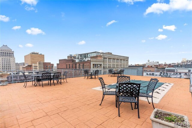 1123 Washington Ave Unit 305, Saint Louis, MO 63101 - view of patio / terrace featuring outdoor dining area and a city view