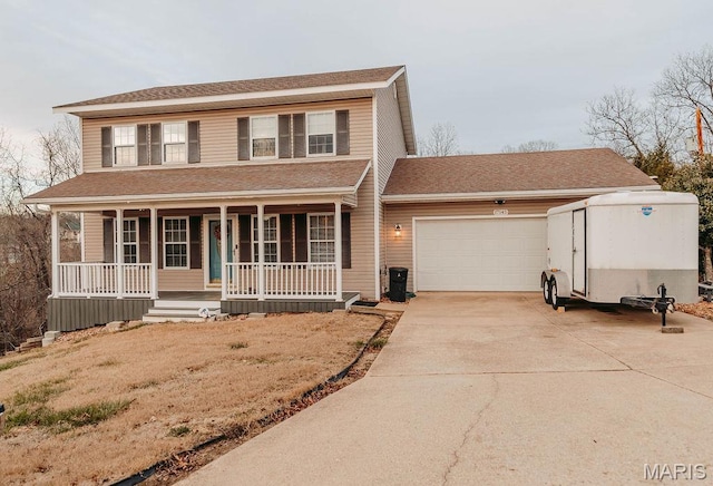17145 Lensman Rd, Saint Robert, MO 65584 - view of front of house featuring a garage, concrete driveway, a porch, and roof with shingles
