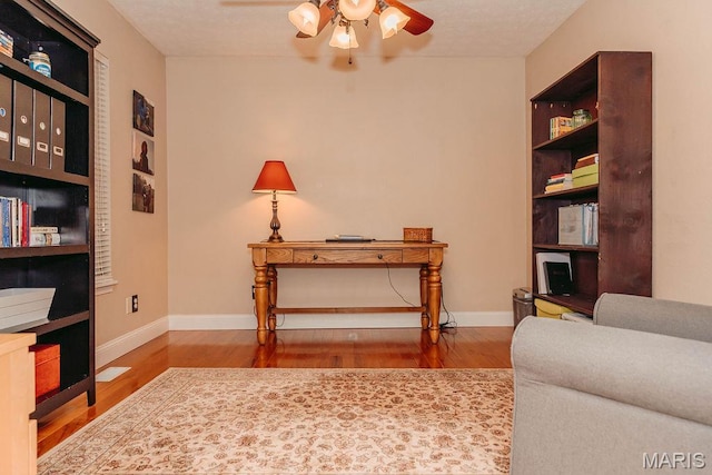 17145 Lensman Rd, Saint Robert, MO 65584 - sitting room with ceiling fan, wood finished floors, and baseboards