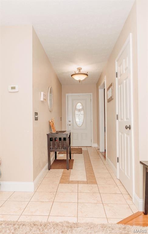 17145 Lensman Rd, Saint Robert, MO 65584 - entrance foyer featuring light tile patterned floors and baseboards
