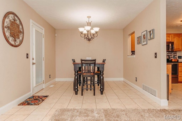 17145 Lensman Rd, Saint Robert, MO 65584 - dining space with a chandelier, light tile patterned floors, and baseboards