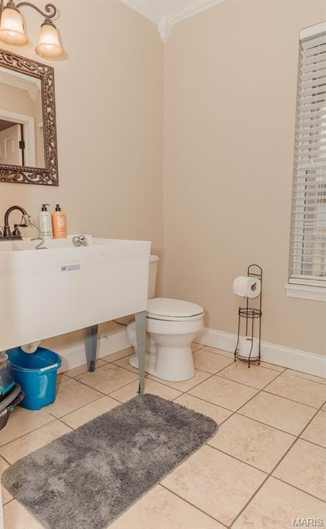 17145 Lensman Rd, Saint Robert, MO 65584 - half bath with crown molding, toilet, tile patterned flooring, and baseboards