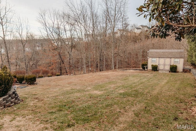 17145 Lensman Rd, Saint Robert, MO 65584 - view of green lawn with a storage unit and an outdoor structure