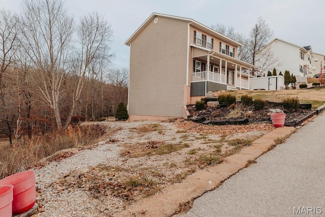 17145 Lensman Rd, Saint Robert, MO 65584 - view of property exterior with a porch