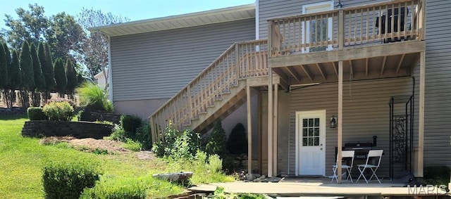 17145 Lensman Rd, Saint Robert, MO 65584 - back of property featuring stairway and a wooden deck