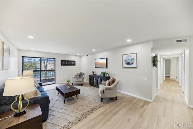 539 Coeur De Royale Dr Unit 201, Saint Louis, MO 63141 - living room featuring light wood finished floors, recessed lighting, and baseboards