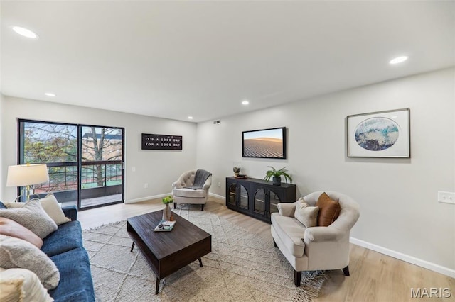 539 Coeur De Royale Dr Unit 201, Saint Louis, MO 63141 - living area with wood finished floors, recessed lighting, and baseboards