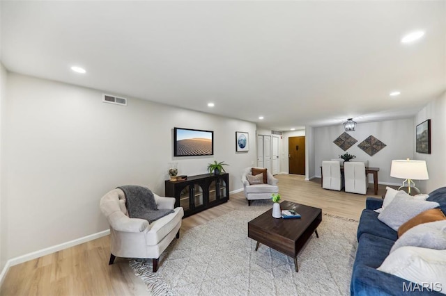 539 Coeur De Royale Dr Unit 201, Saint Louis, MO 63141 - living area featuring light wood-style flooring, baseboards, and recessed lighting