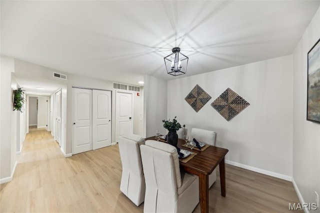 539 Coeur De Royale Dr Unit 201, Saint Louis, MO 63141 - dining room with light wood-type flooring, baseboards, and a chandelier