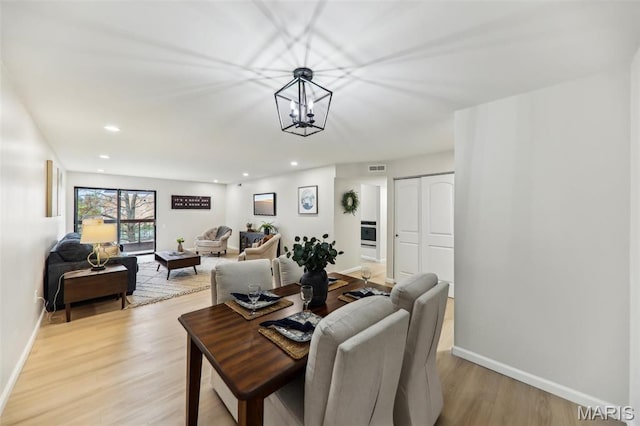 539 Coeur De Royale Dr Unit 201, Saint Louis, MO 63141 - dining space with light wood-style flooring, baseboards, recessed lighting, and a chandelier