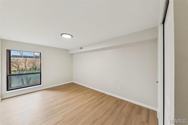 539 Coeur De Royale Dr Unit 201, Saint Louis, MO 63141 - spare room featuring light wood-type flooring and baseboards