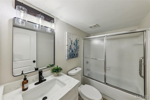 539 Coeur De Royale Dr Unit 201, Saint Louis, MO 63141 - bathroom featuring toilet, vanity, and bath / shower combo with glass door