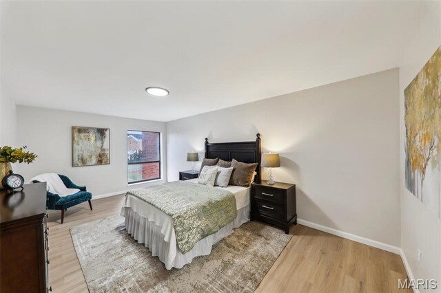 539 Coeur De Royale Dr Unit 201, Saint Louis, MO 63141 - bedroom with light wood-style flooring and baseboards