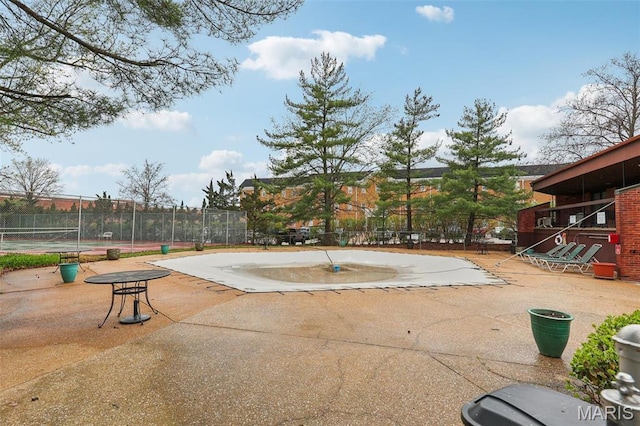 539 Coeur De Royale Dr Unit 201, Saint Louis, MO 63141 - view of swimming pool with a tennis court and fence