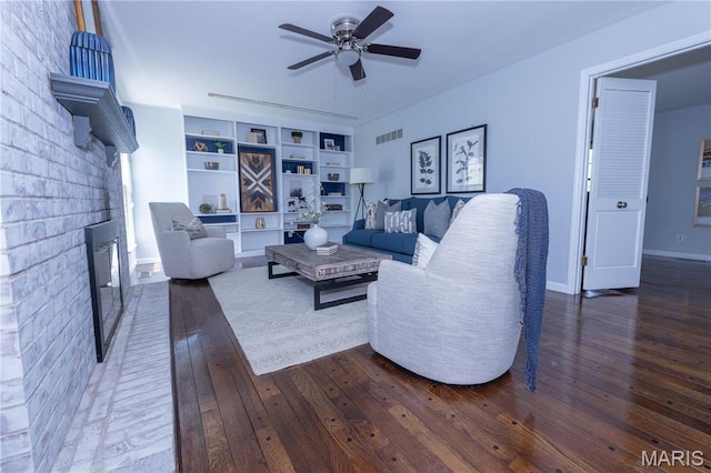 12530 Trammell Ct, Creve Coeur, MO 63141 - living area featuring ceiling fan, hardwood / wood-style flooring, a brick fireplace, and baseboards