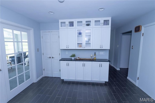 12530 Trammell Ct, Creve Coeur, MO 63141 - kitchen with white cabinetry, glass insert cabinets, baseboards, and recessed lighting