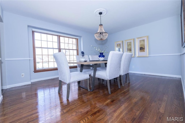 12530 Trammell Ct, Creve Coeur, MO 63141 - dining area featuring a chandelier, wood finished floors, and baseboards