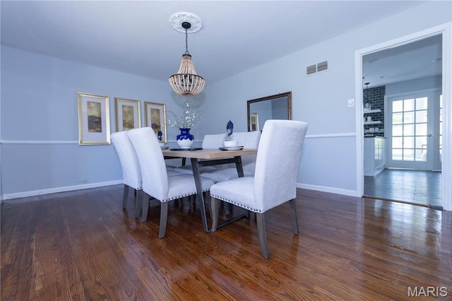 12530 Trammell Ct, Creve Coeur, MO 63141 - dining space with a chandelier, baseboards, and wood finished floors