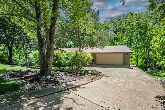 view of front facade with driveway, a garage, and brick siding