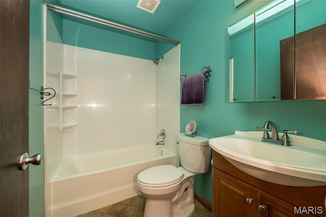 bathroom featuring toilet, vanity,  shower combination, and tile patterned flooring