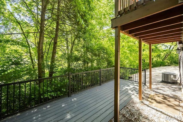 wooden terrace featuring central AC unit