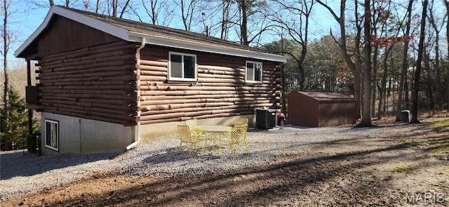 13559 Kitt Park Dr, Saint Genevieve, MO 63670 - view of side of property featuring log exterior and a shed