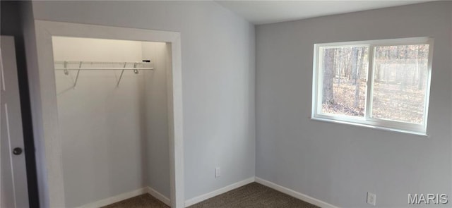 13559 Kitt Park Dr, Saint Genevieve, MO 63670 - unfurnished bedroom with a closet and dark colored carpet