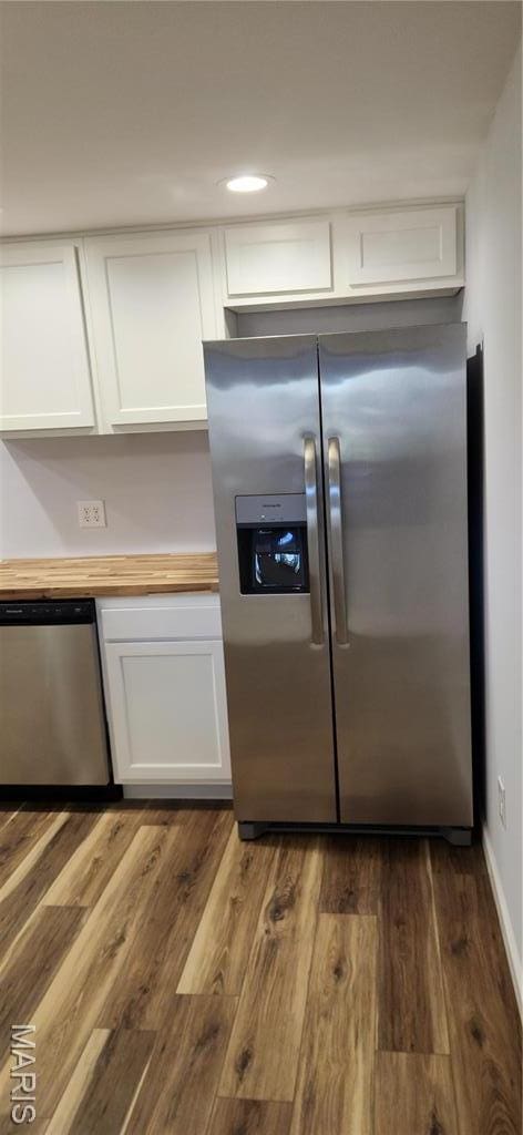 13559 Kitt Park Dr, Saint Genevieve, MO 63670 - kitchen featuring appliances with stainless steel finishes, white cabinets, dark wood-type flooring, wooden counters, and recessed lighting