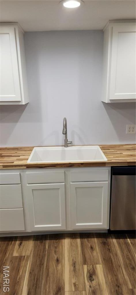 13559 Kitt Park Dr, Saint Genevieve, MO 63670 - kitchen featuring stainless steel dishwasher, wooden counters, white cabinetry, and dark wood-type flooring