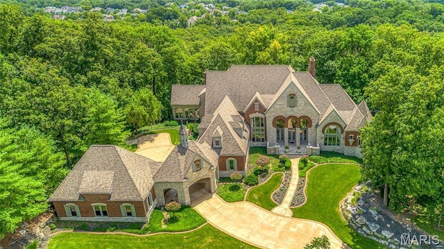 view of subject property featuring a heavily wooded area