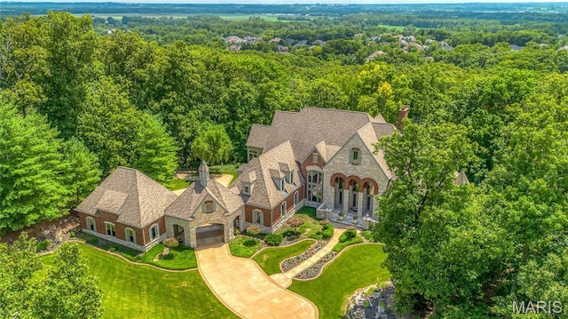 view from above of property with a forest