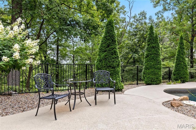 view of patio / terrace featuring fence