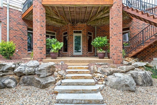 property entrance with brick siding