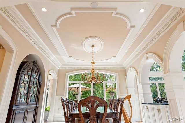 sunroom / solarium featuring a chandelier