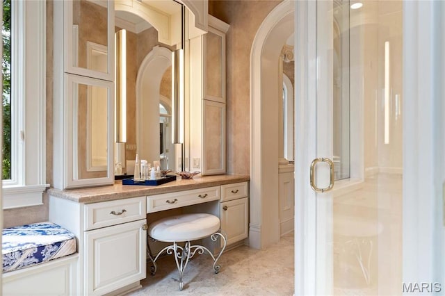 bathroom with healthy amount of natural light and vanity