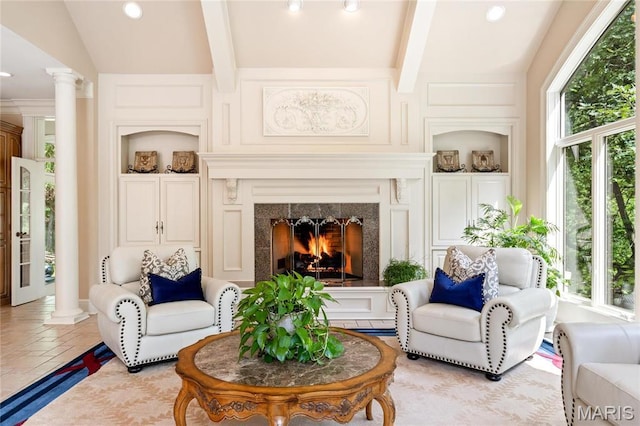 tiled living room featuring ornate columns, a fireplace, beamed ceiling, recessed lighting, and built in shelves